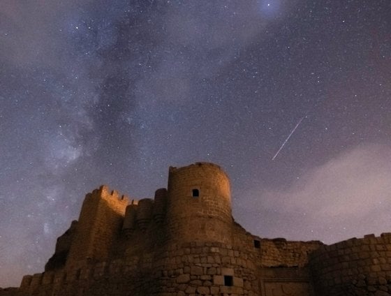 brown concrete building under starry night
