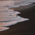 ocean waves crashing on shore during daytime