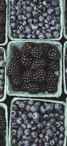 black berries on black surface