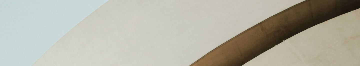 woman standing in front of white building