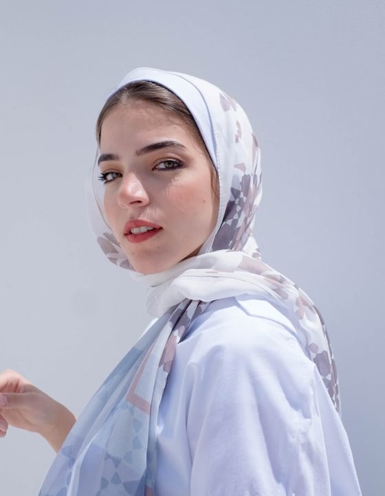 woman in white hijab smiling