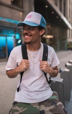 man in white crew neck t-shirt wearing blue cap and black sunglasses