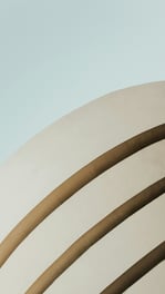 woman standing in front of white building