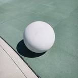 White ball on green floor