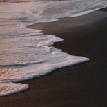 ocean waves crashing on shore during daytime