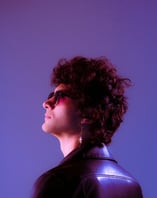 woman in black shirt wearing sunglasses