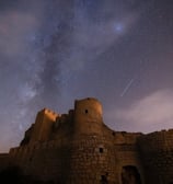 brown concrete building under starry night