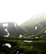 green mountain under white sky during daytime