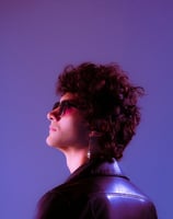 woman in black shirt wearing sunglasses