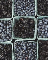 black berries on black surface