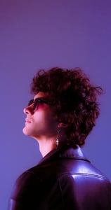 woman in black shirt wearing sunglasses