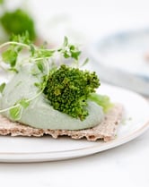 green vegetable on white ceramic plate