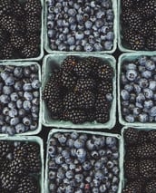 black berries on black surface
