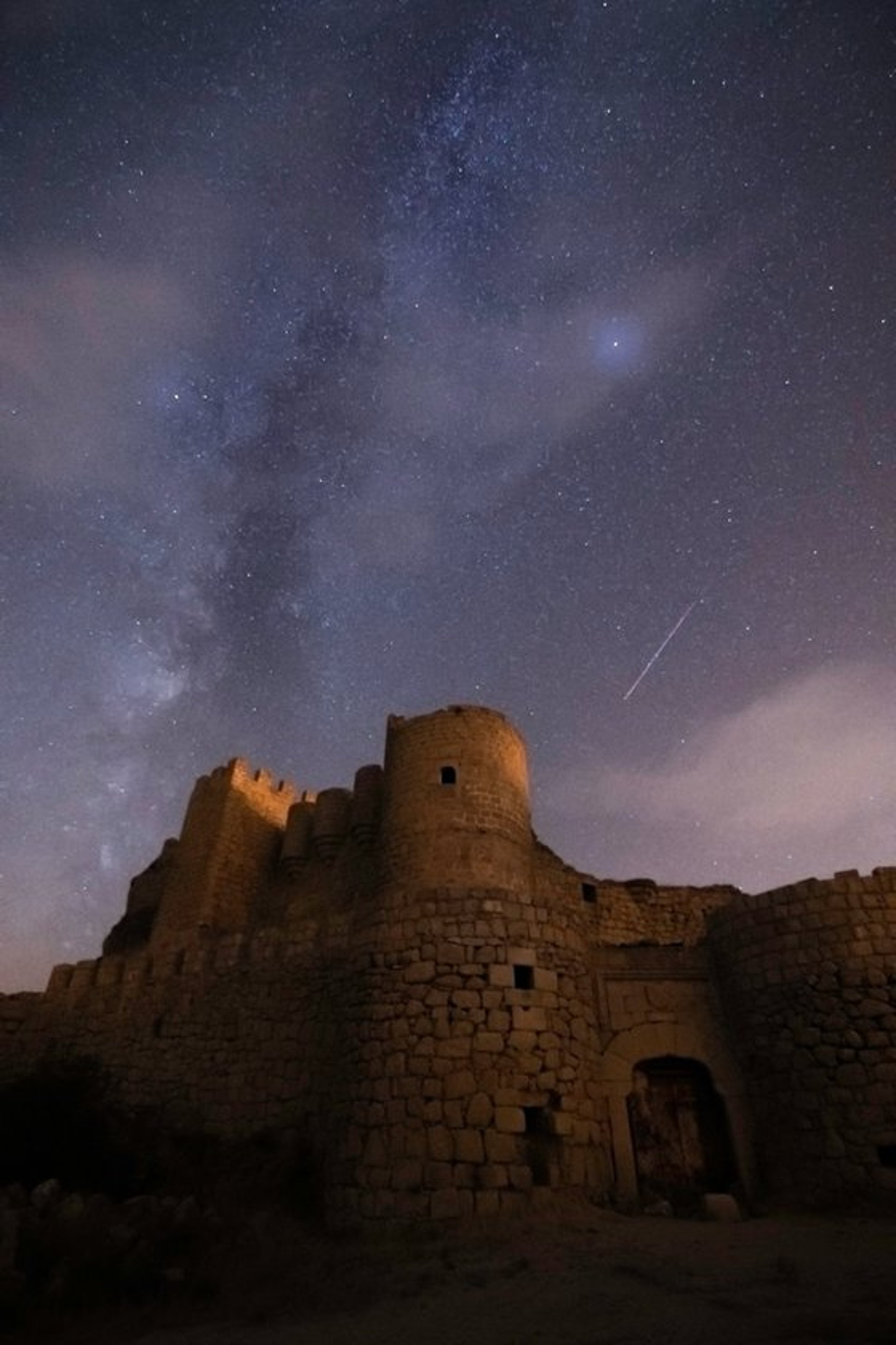 brown concrete building under starry night