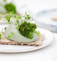 green vegetable on white ceramic plate