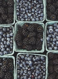 black berries on black surface