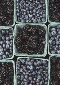 black berries on black surface