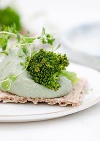 green vegetable on white ceramic plate