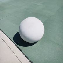 White ball on green floor