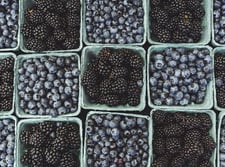 black berries on black surface