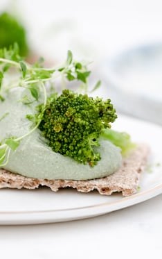 green vegetable on white ceramic plate
