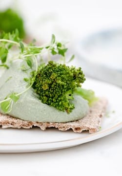 green vegetable on white ceramic plate