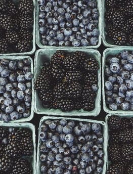 black berries on black surface