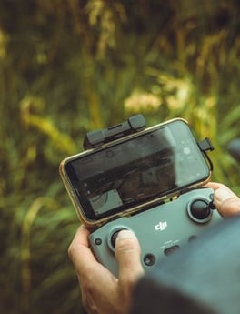 person holding black and gray digital camera