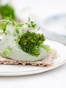 green vegetable on white ceramic plate