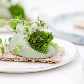 green vegetable on white ceramic plate