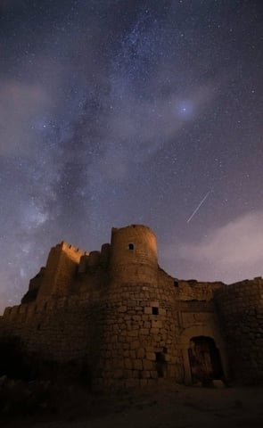brown concrete building under starry night