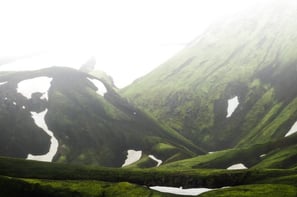 green mountain under white sky during daytime