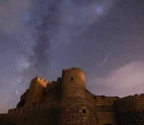 brown concrete building under starry night