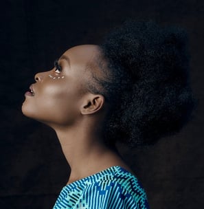 woman in blue and white shirt
