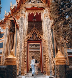man and woman standing in front of brown concrete building during daytime
