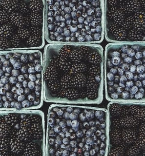 black berries on black surface