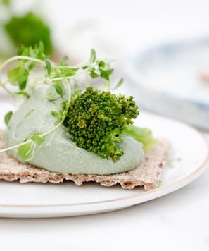 green vegetable on white ceramic plate