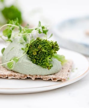 green vegetable on white ceramic plate