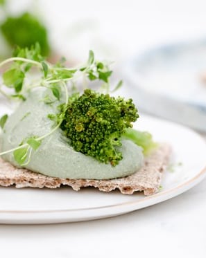 green vegetable on white ceramic plate