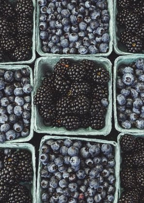 black berries on black surface