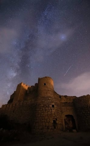 brown concrete building under starry night