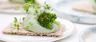 green vegetable on white ceramic plate