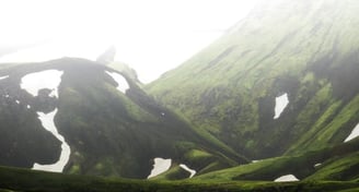 green mountain under white sky during daytime