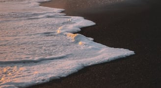 ocean waves crashing on shore during daytime