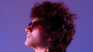 woman in black shirt wearing sunglasses