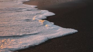 ocean waves crashing on shore during daytime