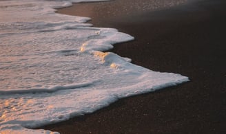ocean waves crashing on shore during daytime