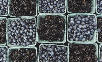 black berries on black surface