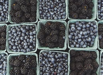 black berries on black surface