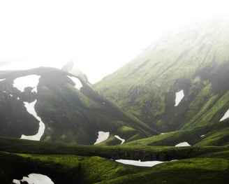 green mountain under white sky during daytime